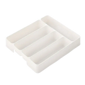 White plastic kitchen drawer adjustable utensil organizer tray with four rectangular compartments for efficient storage