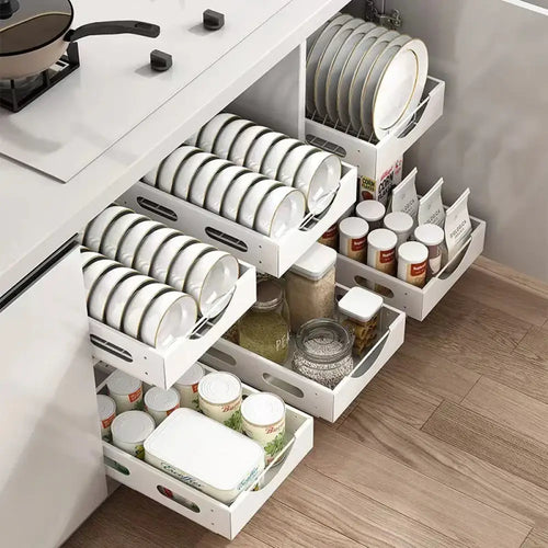 Adjustable white wooden kitchen drawer dividers with sleek minimalist design holding ceramic plates and cutlery