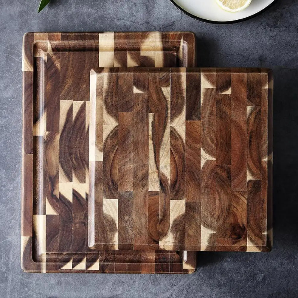 Rectangular solid wood cutting board with a striped parquet mosaic pattern in dark and light brown tones