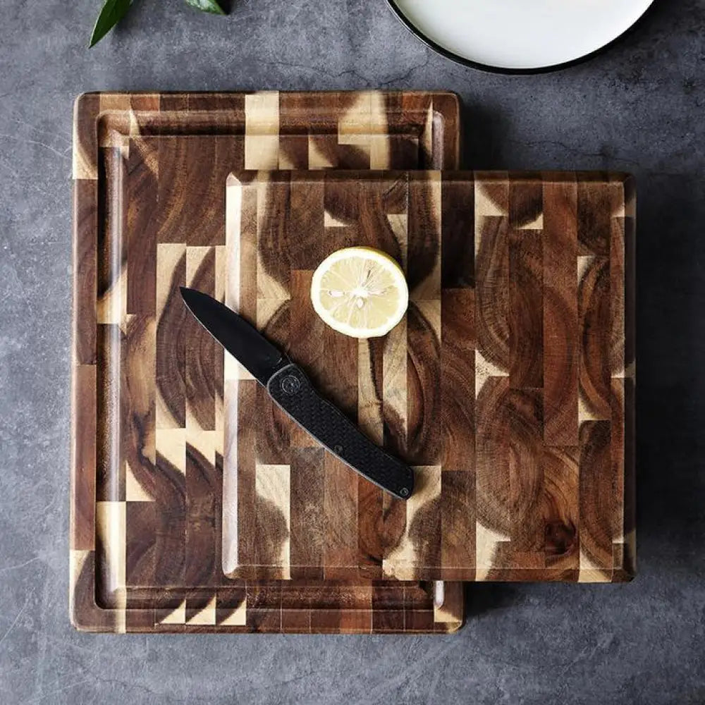 Rectangular wooden cutting board with a geometric pattern of dark and light brown wood pieces for kitchen use
