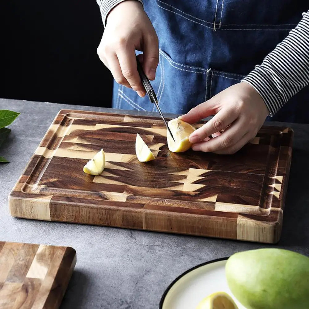 Rectangular striped parquet solid wood cutting board with a geometric pattern of dark and light wood tones