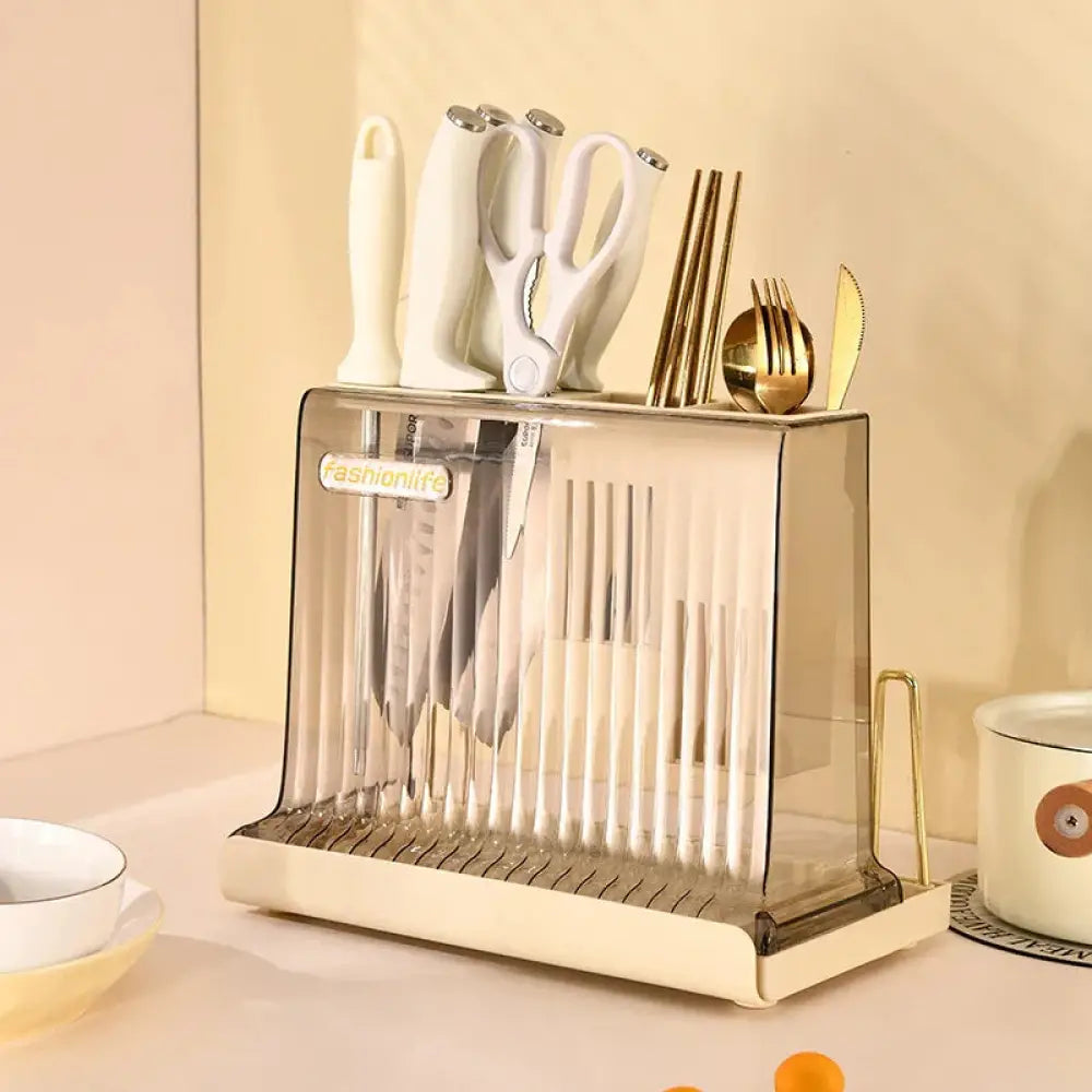 Cream acrylic knife block and cutlery storage rack with transparent organizer and cream base holding various utensils