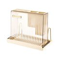 Cream acrylic knife block with beige translucent plastic toothbrush holder featuring vertical ridges and gold-tone stand