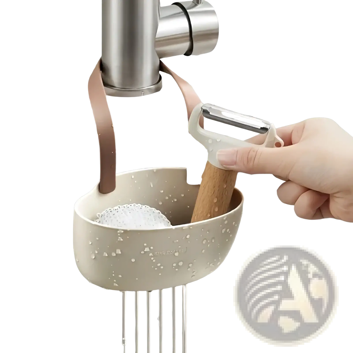 Beige plastic kitchen sink organizer hanging sponge caddy with soft pink strap holding a sponge and peeler