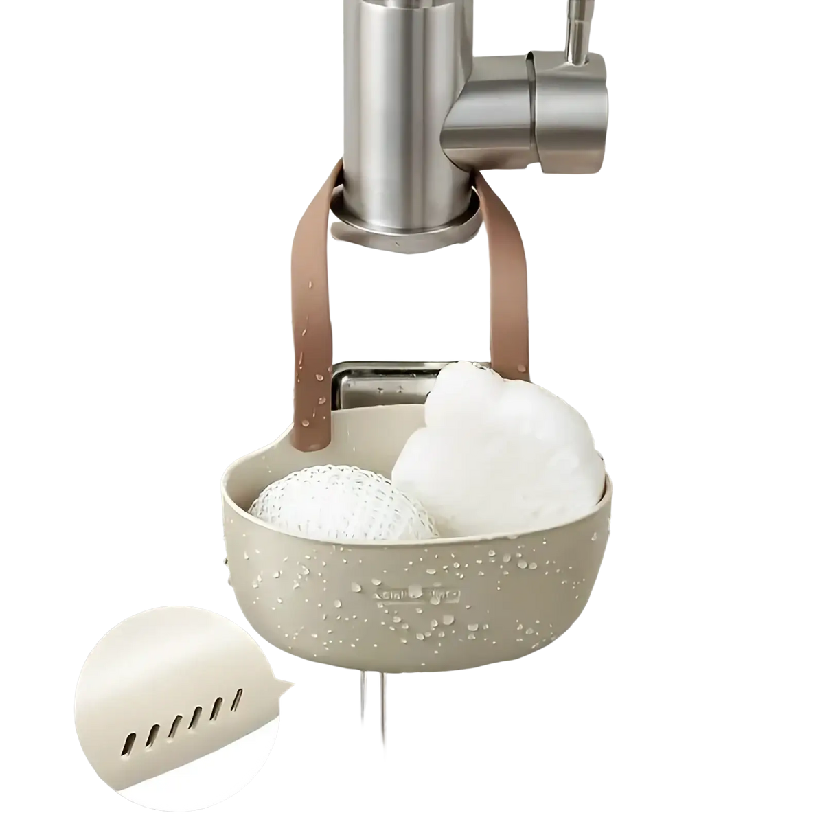 Beige silicone kitchen sink organizer with brown leather straps and slotted bottom for hanging sponge storage