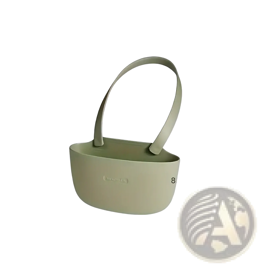 A sleek matte sage green silicone kitchen sink organizer hanging sponge caddy with minimalist design and integrated handle