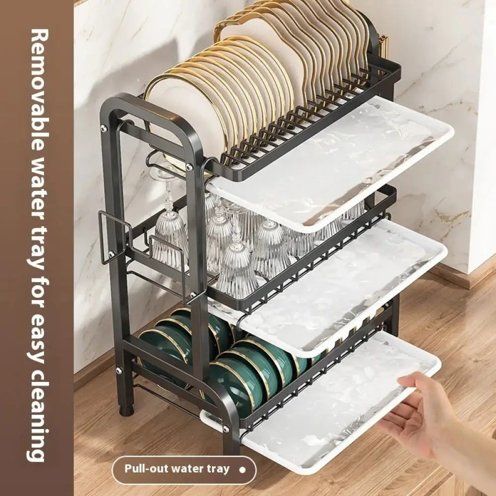 3-tier black metal dish rack with white marble-patterned pull-out water trays holding plates glasses and bowls