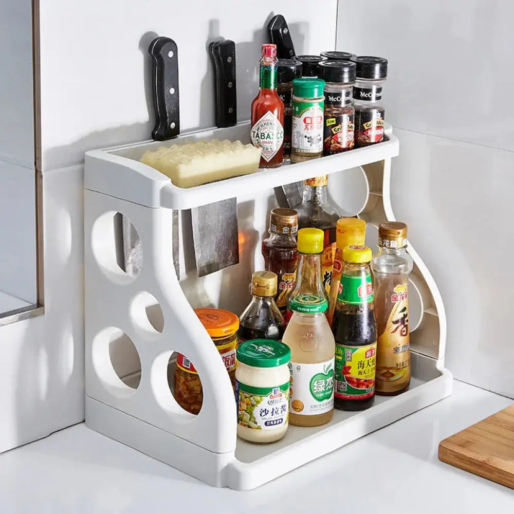 White plastic multilayer two tier kitchen spice and utensil organizer rack with circular cutouts and integrated knife holder