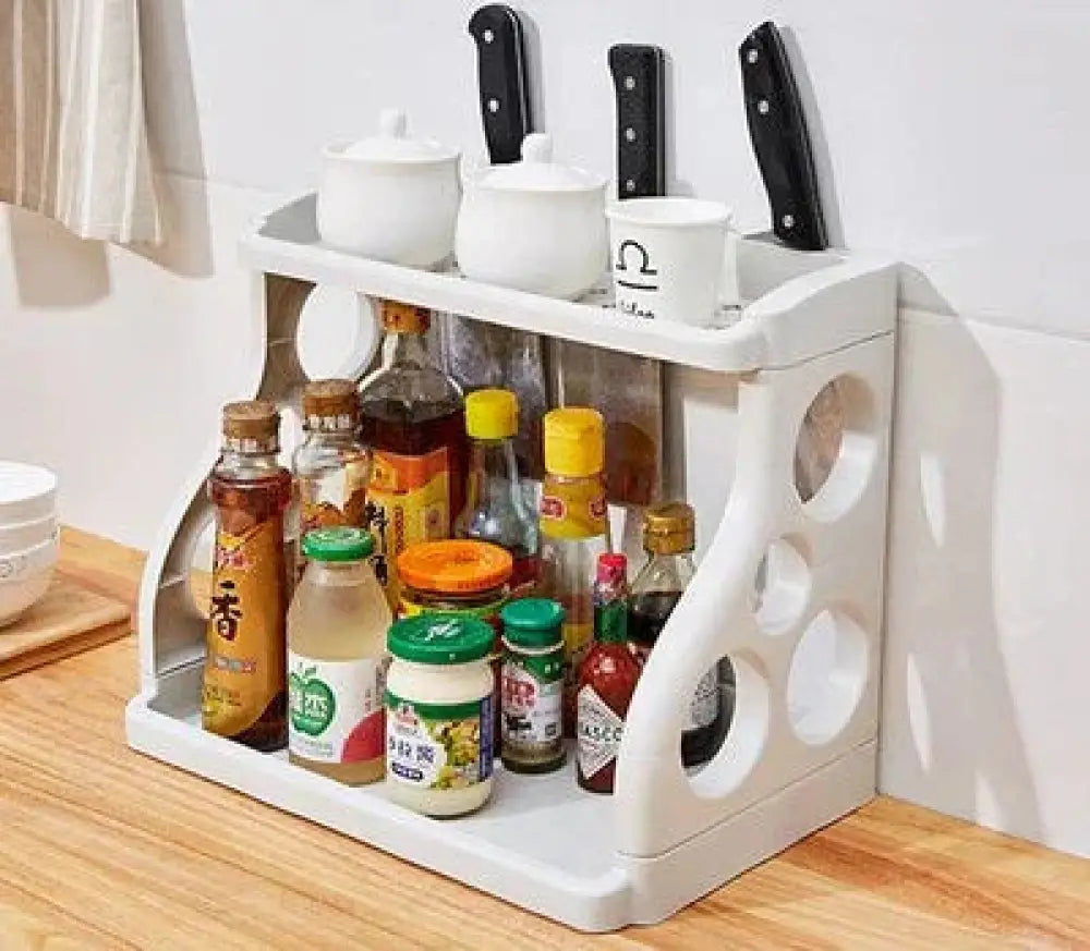 White plastic multilayer two tier kitchen spice and utensil organizer rack with circular cutouts and knife slots
