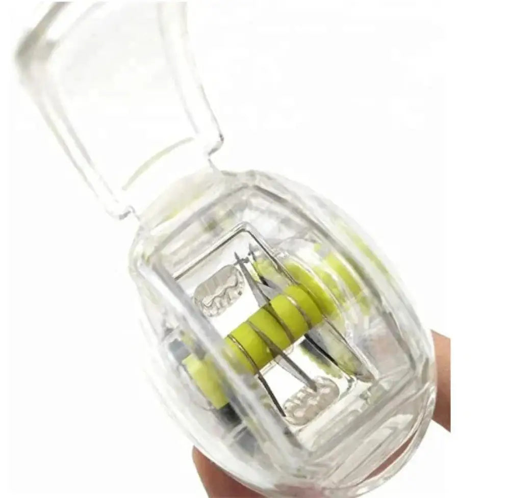 Ergonomic clear garlic press and mincer with precision metallic blades and lime green rollers in clear plastic casing