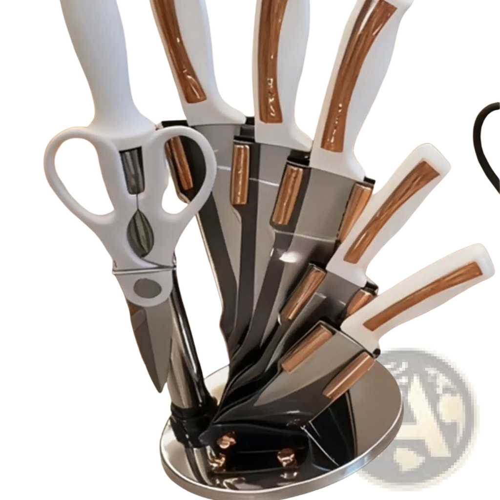 Modern kitchenware knife set with stainless steel blades white and rose gold handles and sleek chrome stand