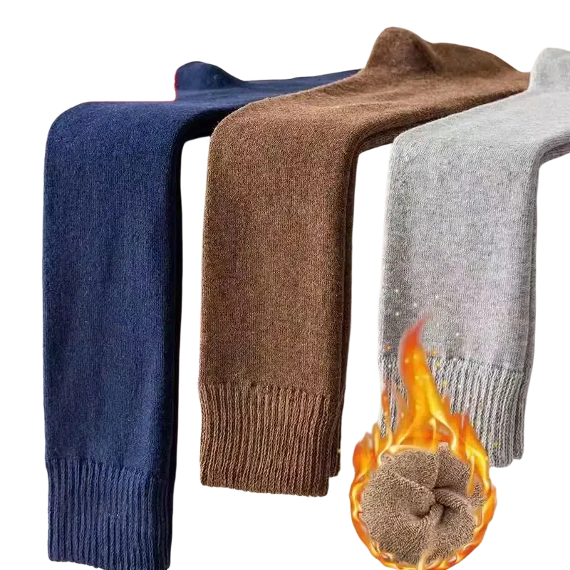 Knee long socks in navy blue brown and gray knitted from wool with flame graphic highlighting warm longer stocking design