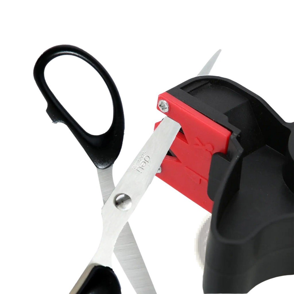 Knife sharpener and scissor sharpening kitchen tool with red and black plastic body and silver blade being sharpened