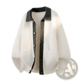 Cream-colored knit cardigan with contrast dark gray collar and button placket showcasing elegant knitwear design