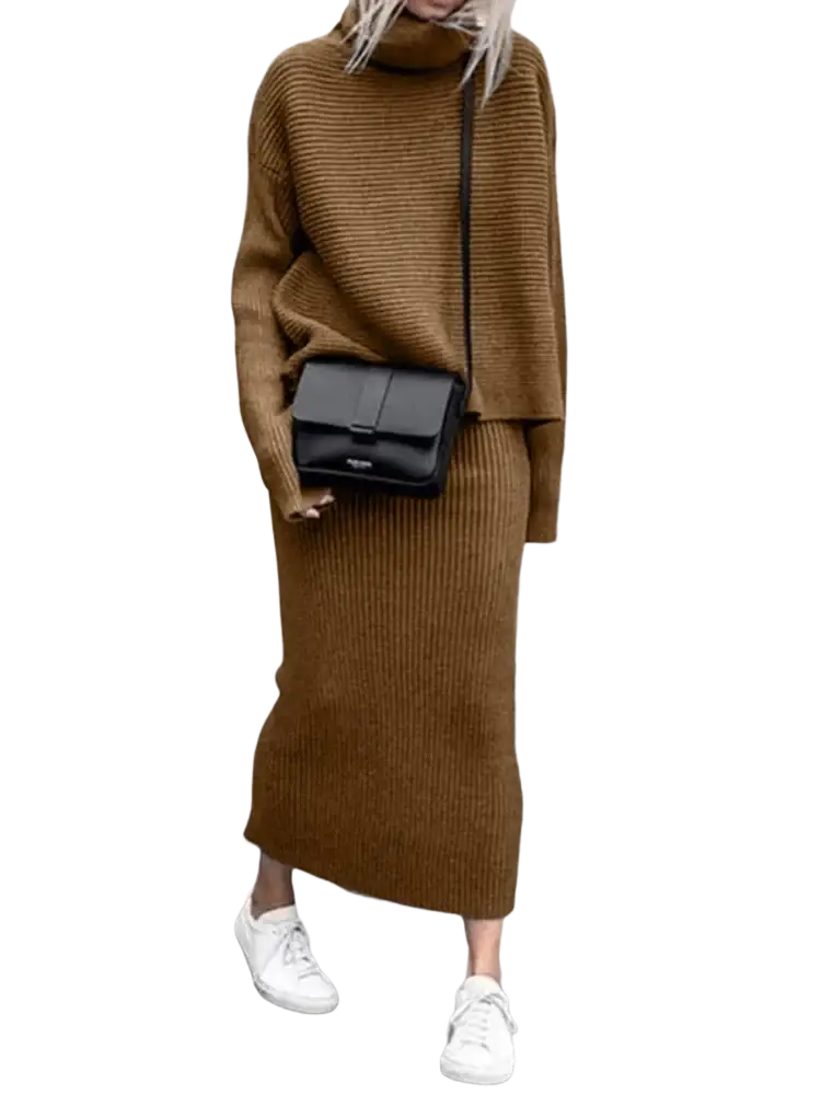 Black crossbody bag with minimalist design and smooth leather finish paired with knit sweater set long sleeve midi skirt
