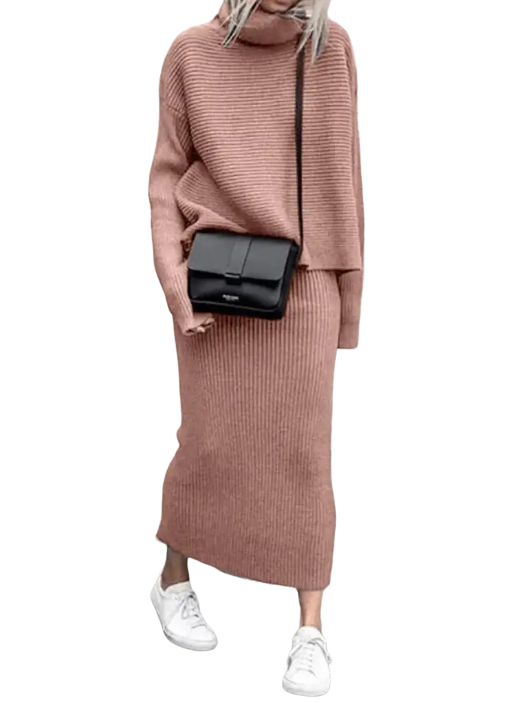 Black rectangular crossbody bag with minimalist design and subtle branding paired with knit sweater set long sleeve midi skirt