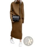 Black crossbody bag with minimalist design and smooth leather finish paired with knit sweater set long sleeve midi skirt