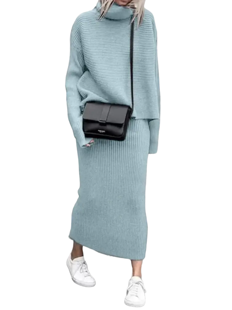 A sleek black leather crossbody bag with minimalist design paired with knit sweater set long sleeve midi skirt