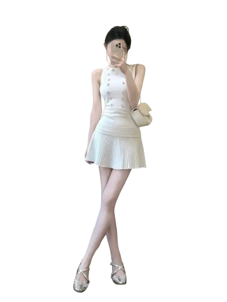 White pleated mini dress with button detailing closure type and length 40cm in knit tank top and pleated skirt set