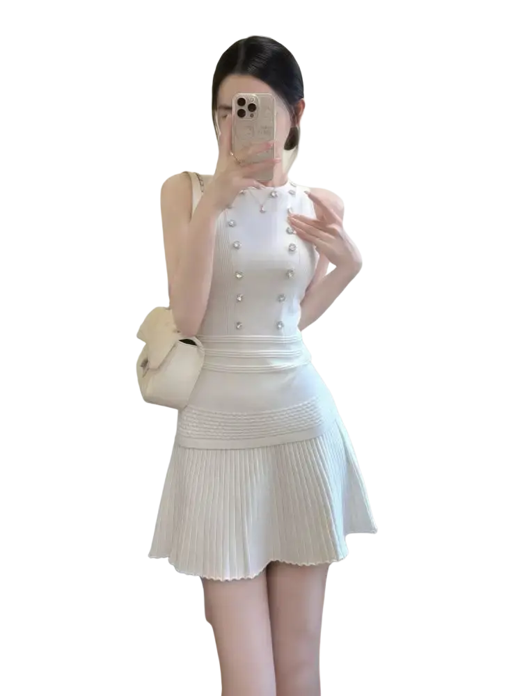White knit sleeveless dress with pearl embellishments and pleated skirt closure type zipper length 40cm size information included