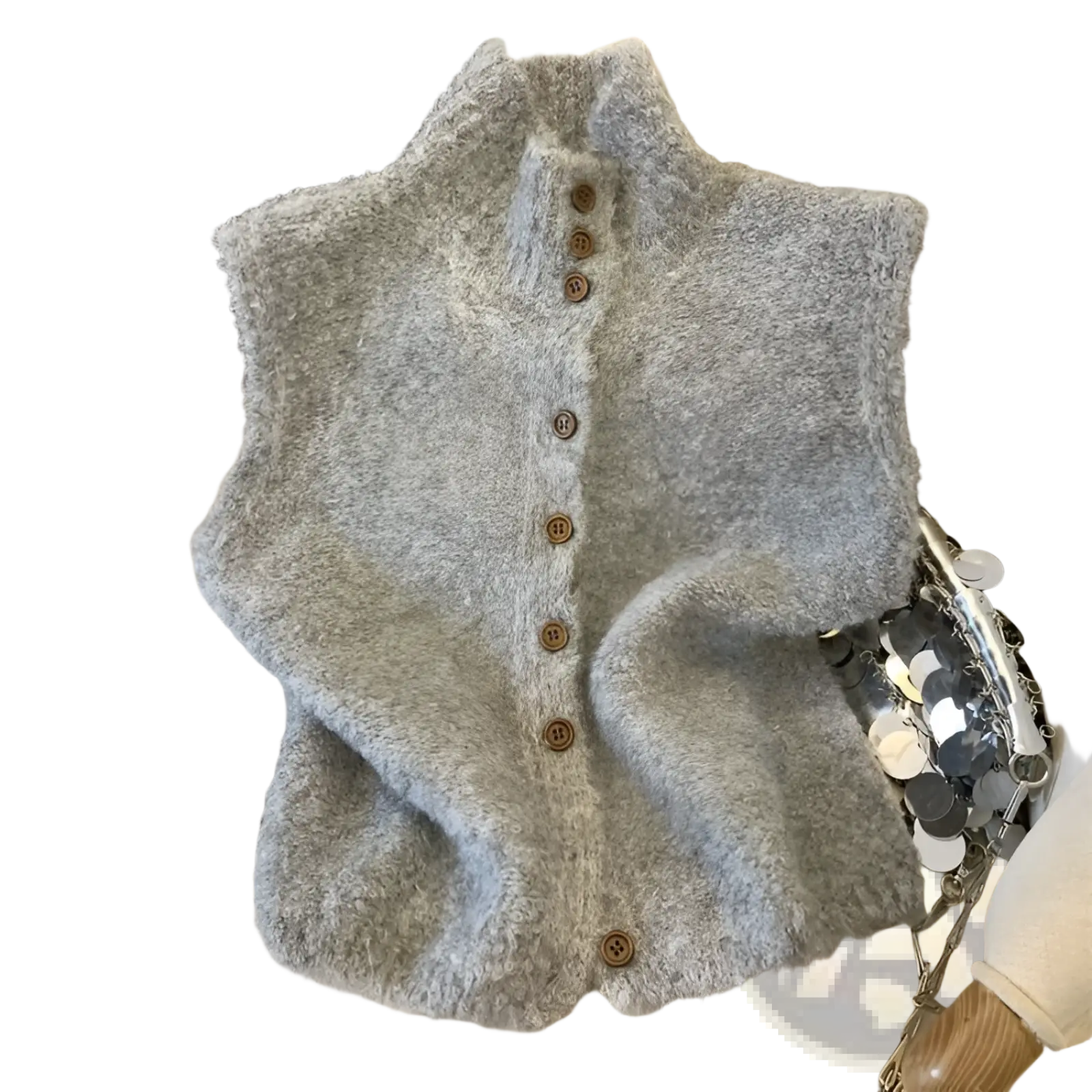 A soft fluffy gray knit sleeveless vest with high neck and brown wooden buttons suitable for layering