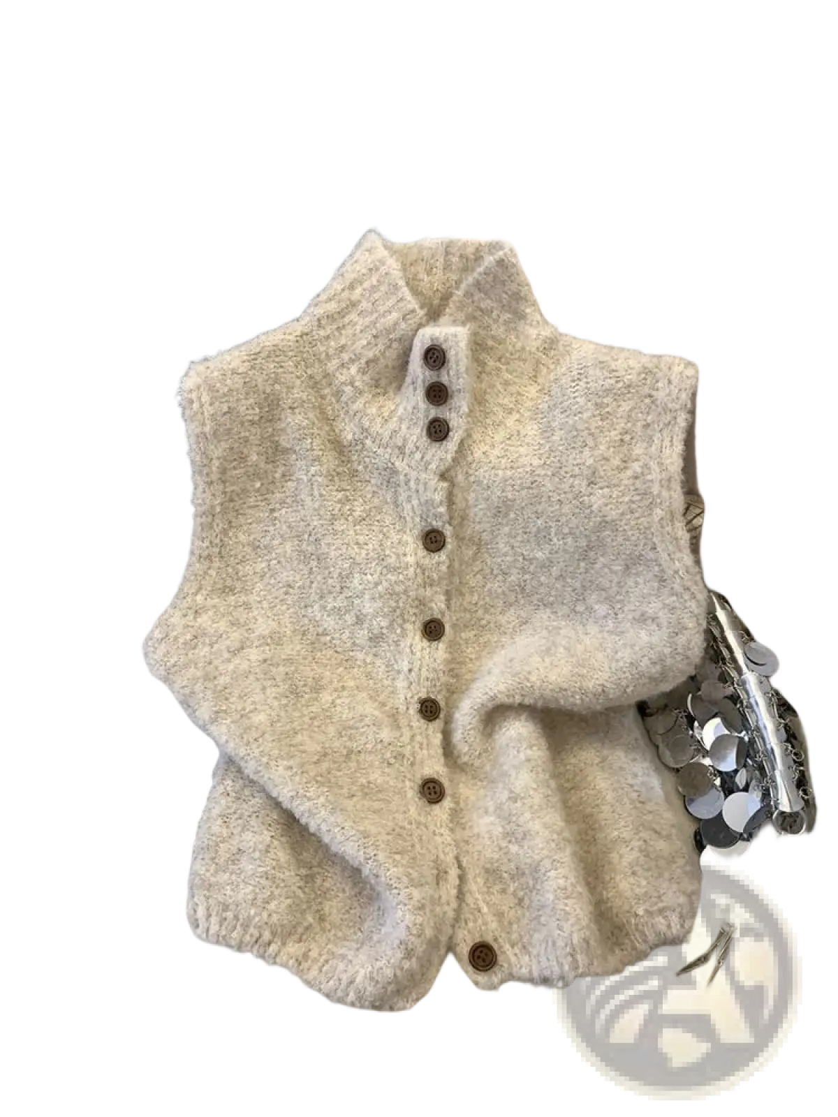 Cream-colored knit vest with high neck, textured material, and brown buttons down the front
