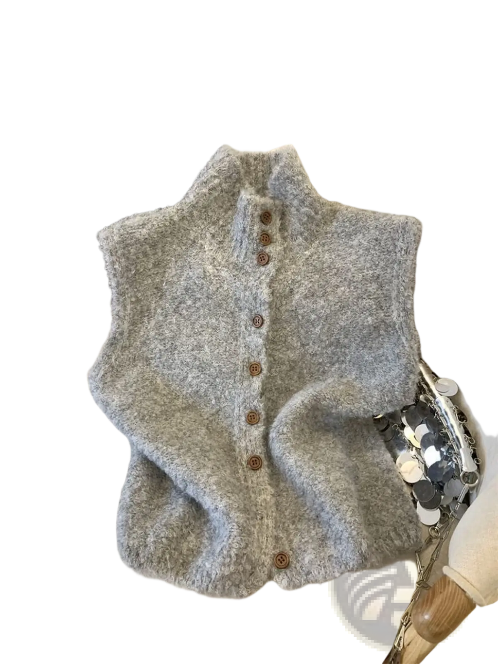 A soft fluffy gray knit vest with a high neck and wooden buttons made from cozy knit material