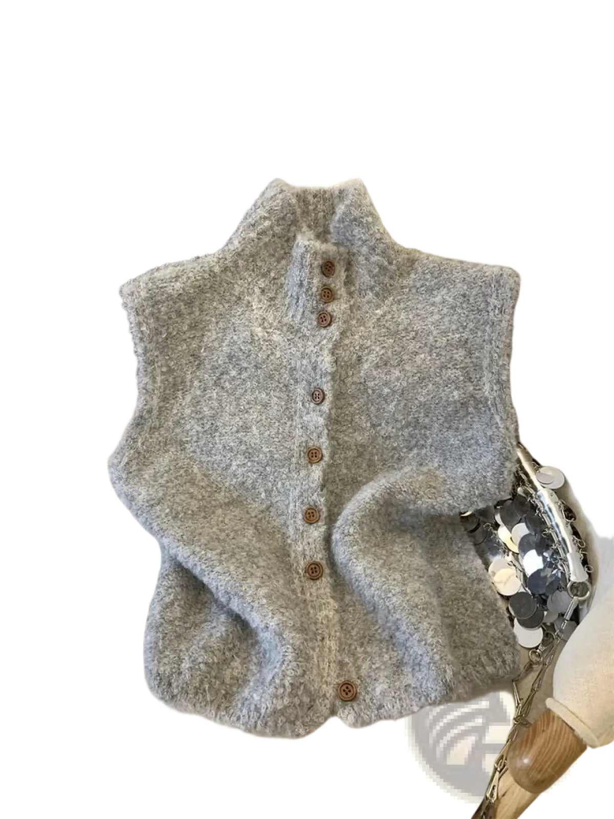 A soft fluffy gray knit vest with a high neck and wooden buttons made from cozy knit material