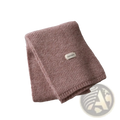 A soft pink ribbed knit cashmere winter scarf for women with a small rectangular vegetable label stitched on it