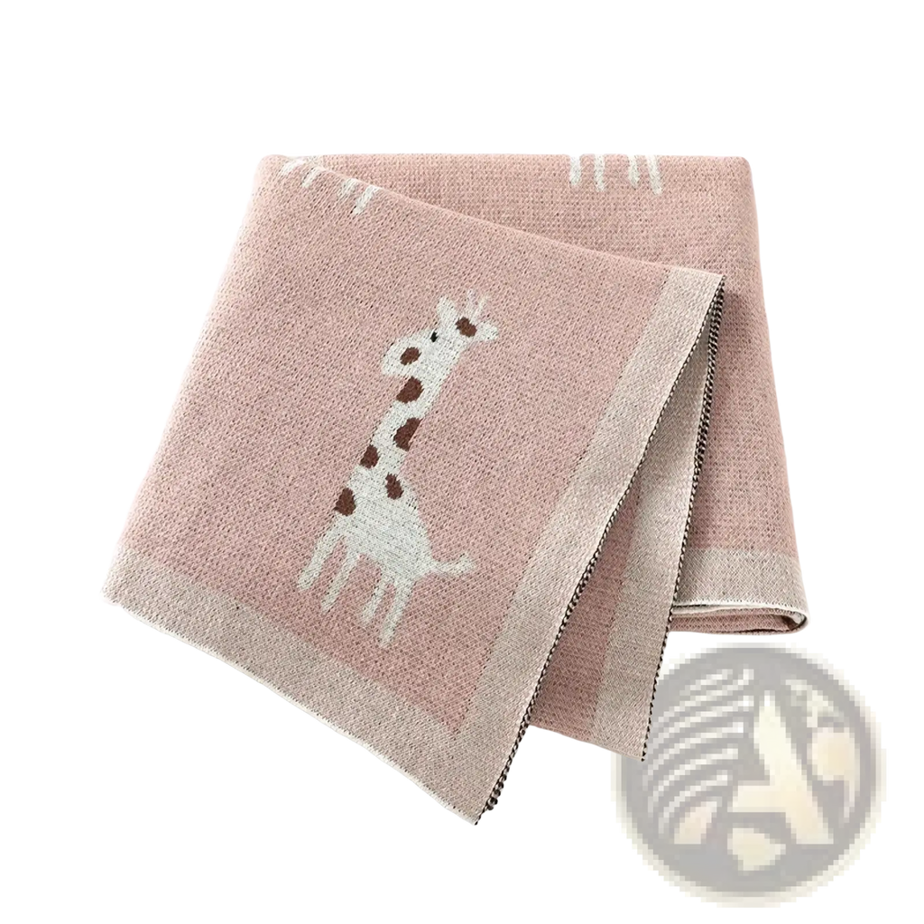 Knitted cotton giraffe baby blanket in soft pink featuring a white and brown giraffe design with textured weave