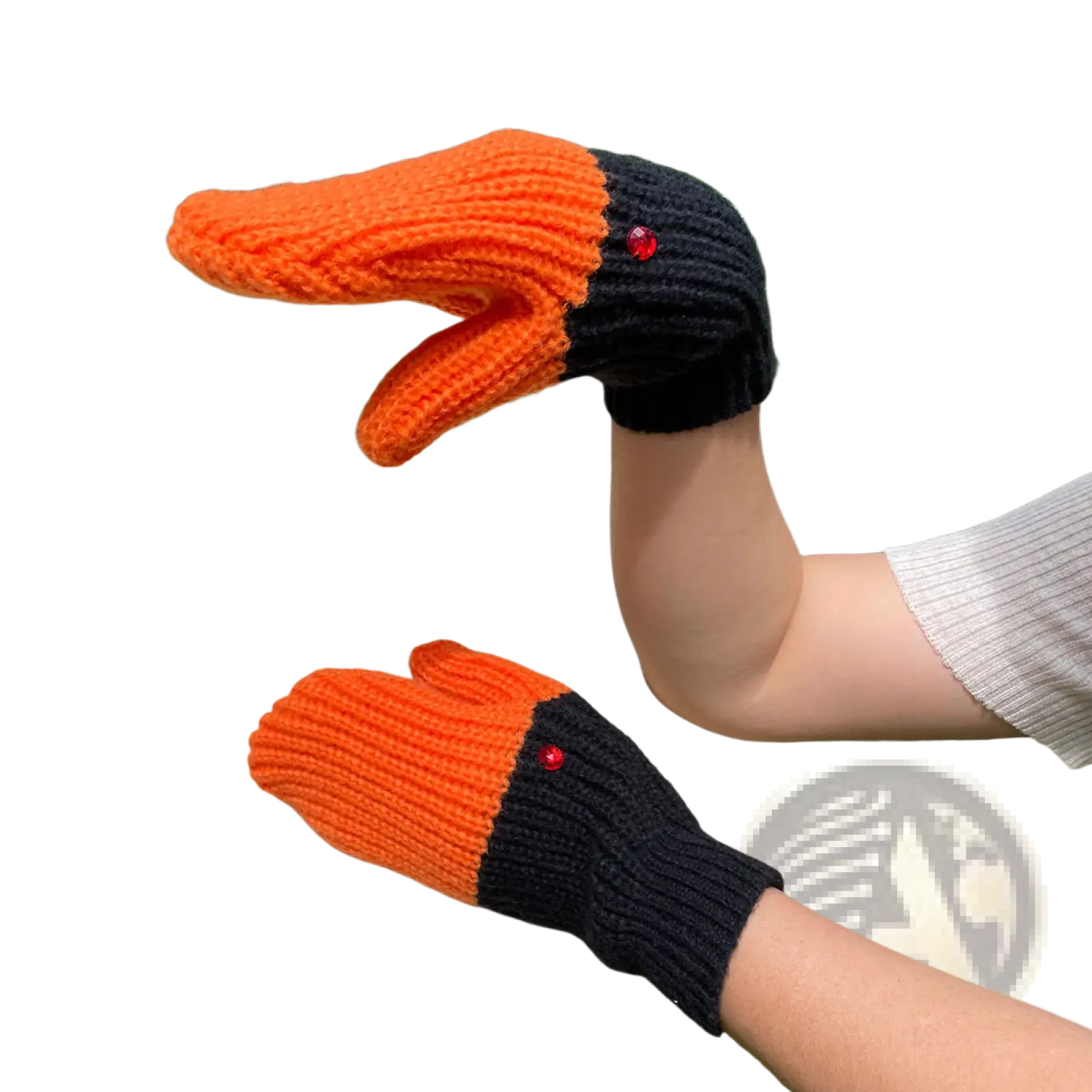 Knitted duck hand puppet winter mittens in orange and black with red gemstone eyes made of woolen yarn