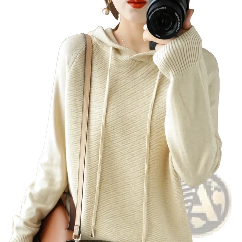 Cream-colored knitted hooded sweatshirt for women featuring ribbed cuffs and cozy textured fabric