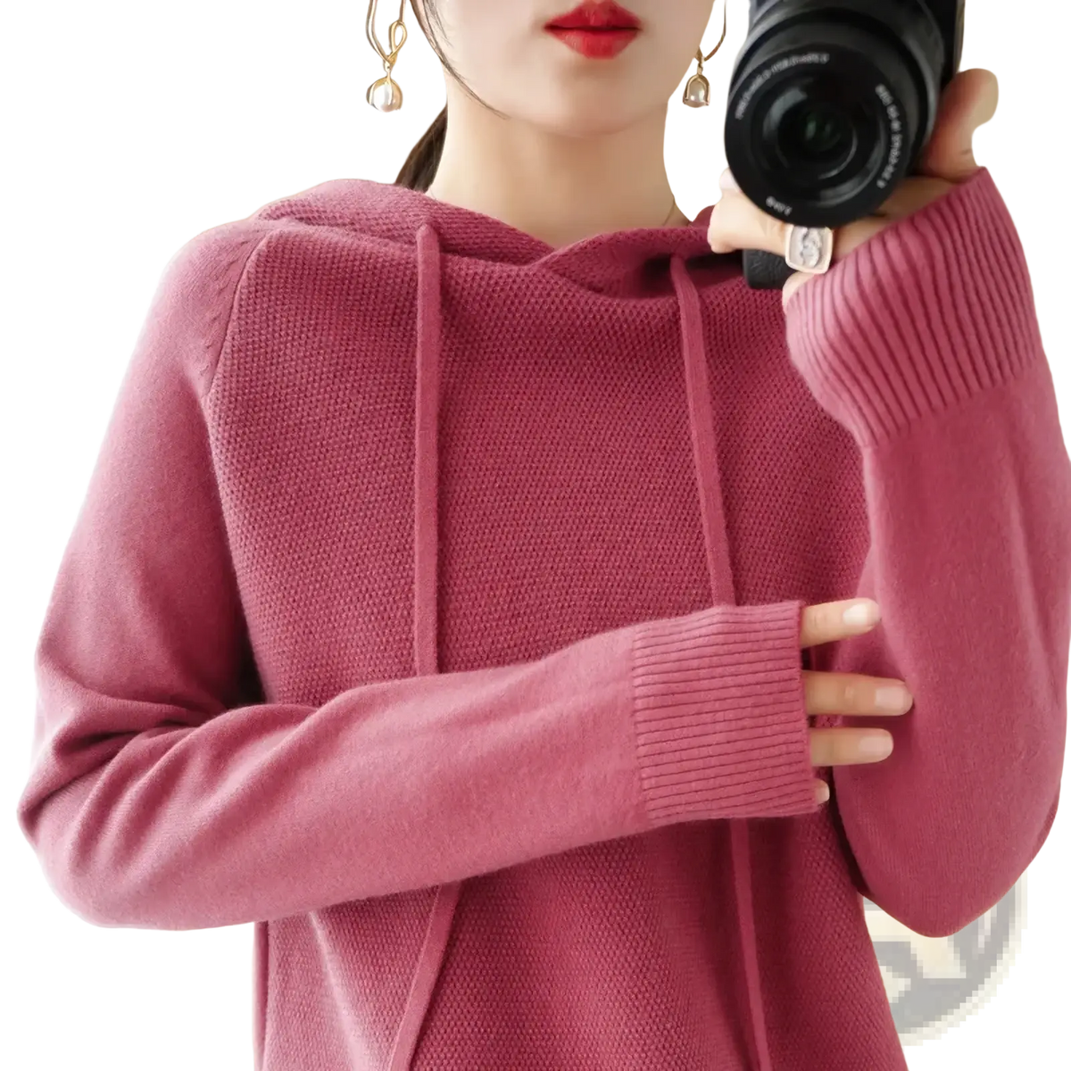 A soft pink knitted hooded sweatshirt for women with ribbed cuffs and a drawstring hood