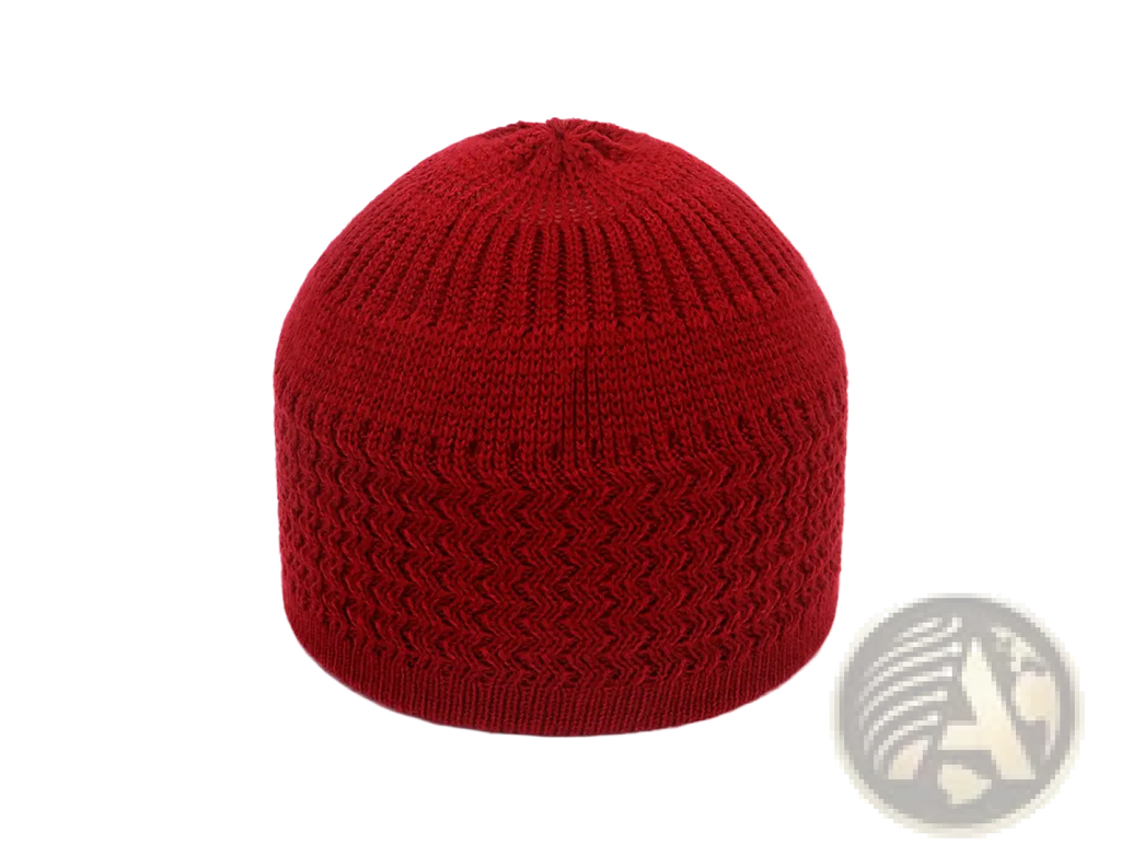 A vibrant red knitted jacquard winter beanie hat with ribbed texture and zigzag pattern on the lower half