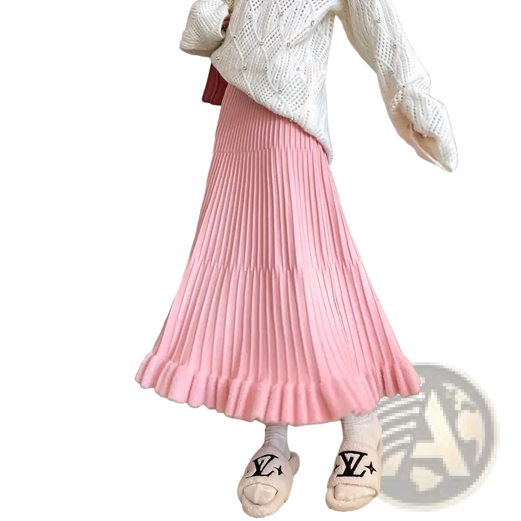 Pink knitted midi skirt high waist pleated umbrella style with soft flowing silhouette and subtle texture