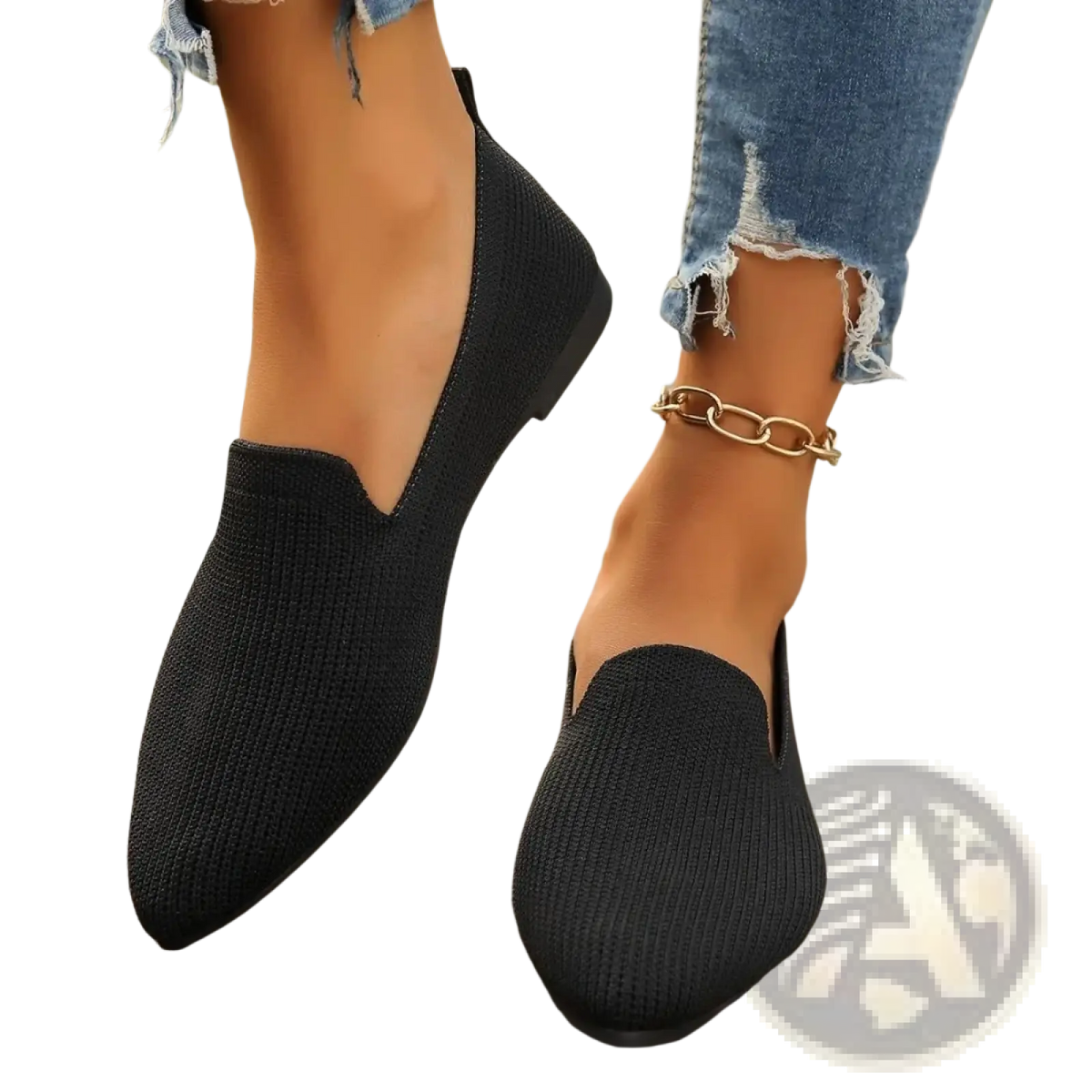 Black knitted slip-on flats with a pointed toe and flat sole designed for comfortable everyday wear