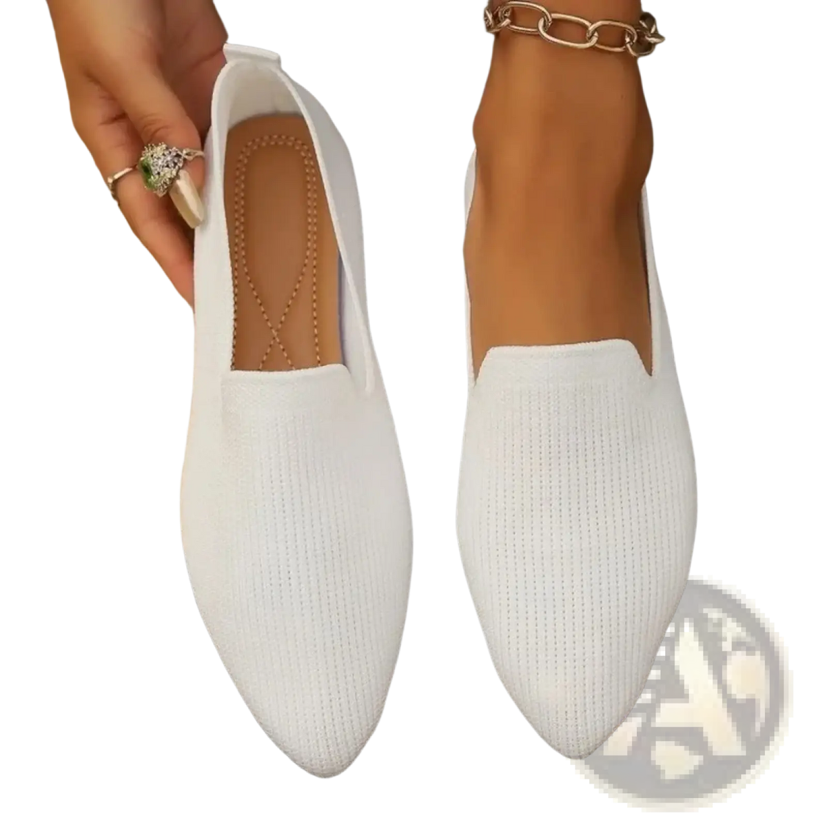 White knitted slip-on flats with a pointed toe made of soft breathable fabric for comfortable wear