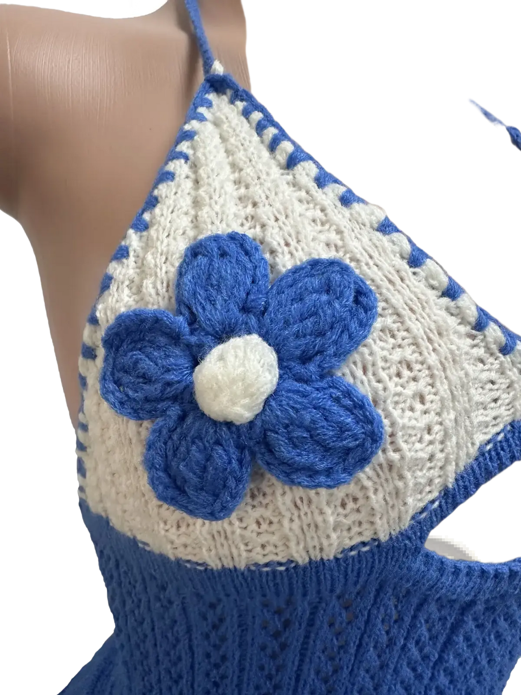 Blue and white crocheted halter top with prominent blue flower appliqué featured in knitted ruffle halter romper summer playsuit