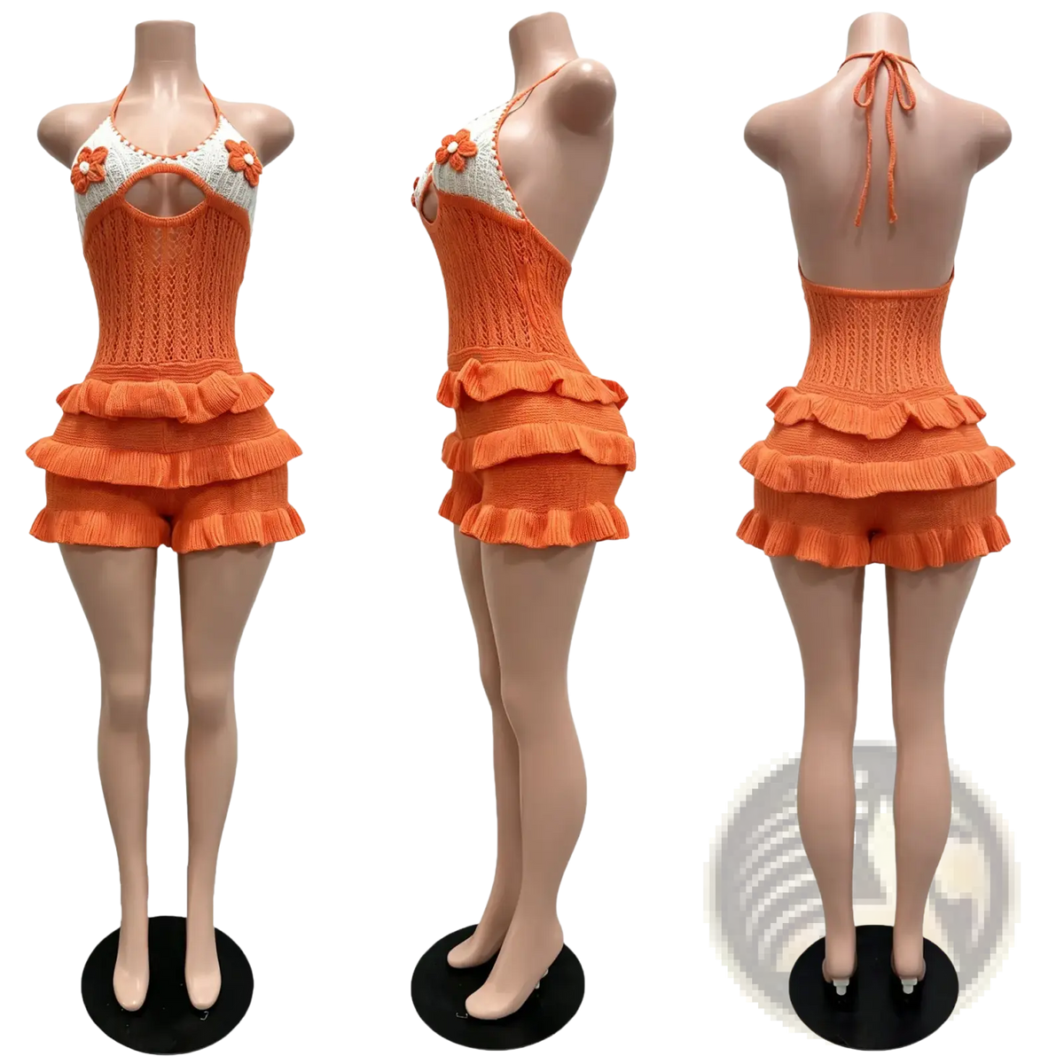 Orange knitted halter romper with ruffled shorts and floral embellishments for summer playsuit wear