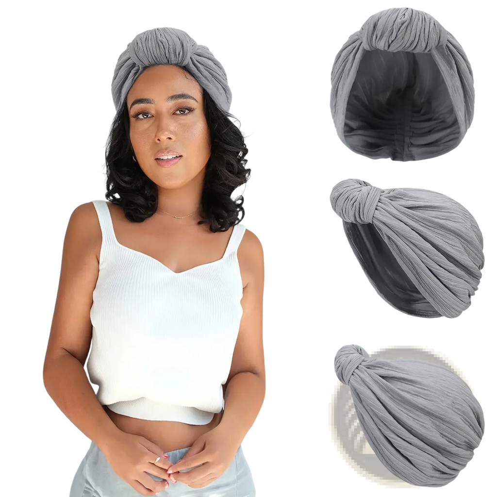 Gray knitted turban cap with twisted fabric and gathered knot featuring a soft textured surface for warm winter wear