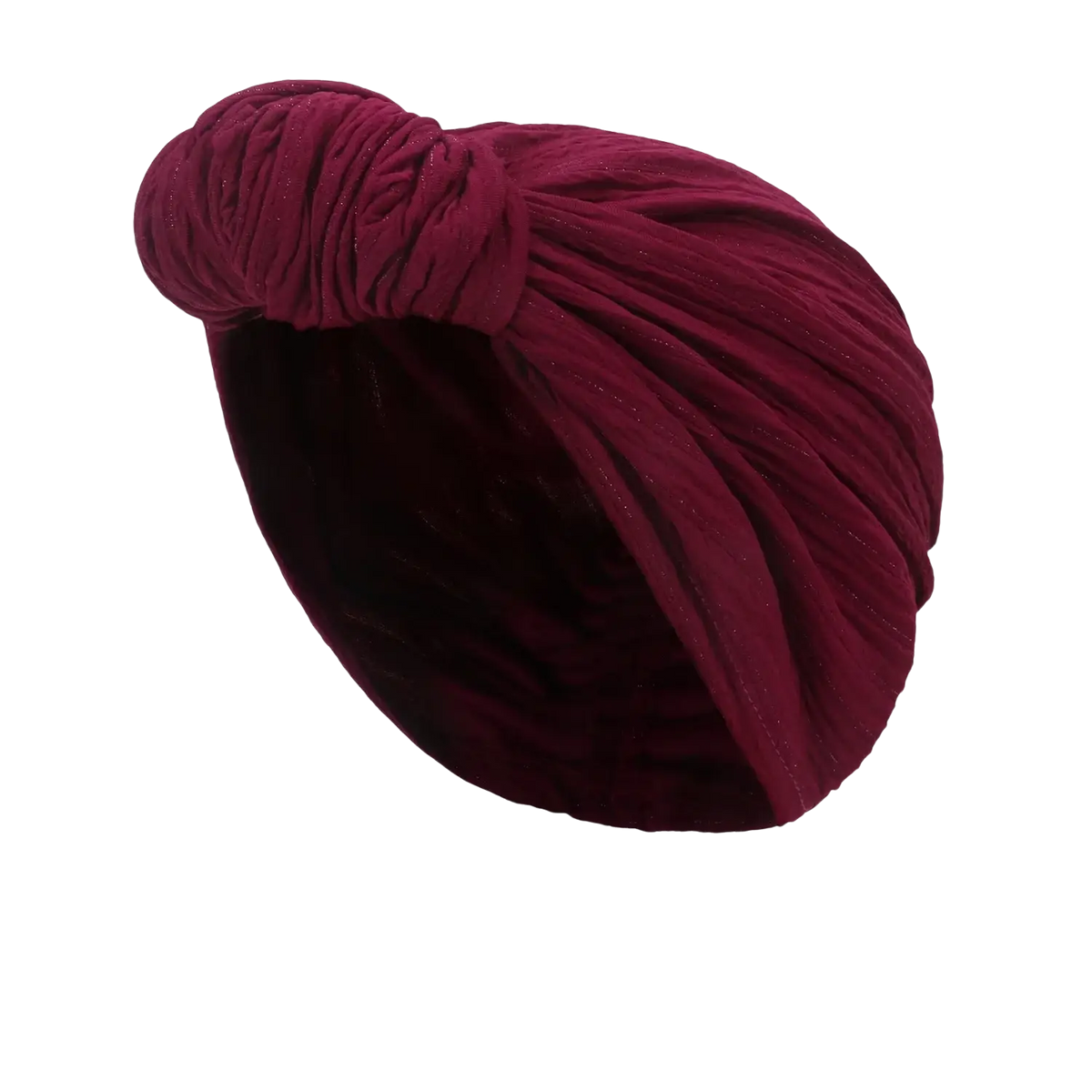 A plush deep rose velvet knitted turban cap with a twisted knot design for warm winter headwear