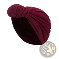 A plush deep rose velvet knitted turban cap with a twisted knot design for warm winter headwear