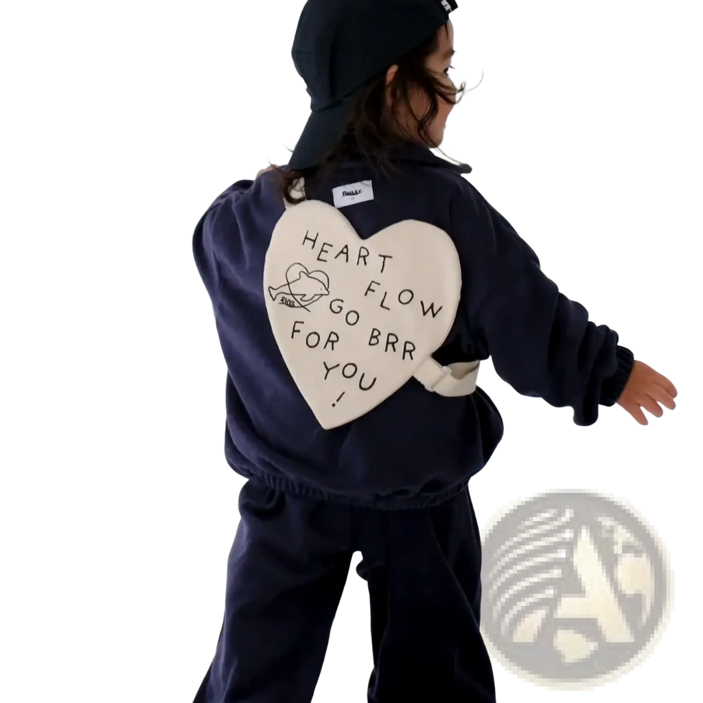 Back side of navy blue fleece jacket with cream heart patch featuring black embroidered text and illustration for Korean kids heart crossbody bag product