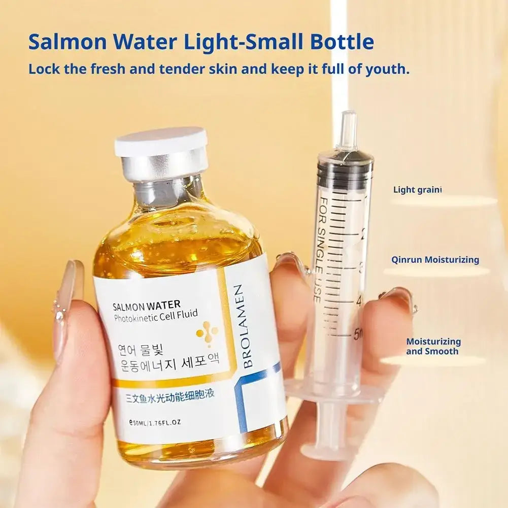A clear glass bottle of brolamen korean salmon anti-aging serum with golden fluid for skin barrier function and hydration