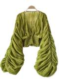 A vibrant olive green Korean v-neck lantern sleeve chiffon blouse with ruched long sleeves and a smocked waistband