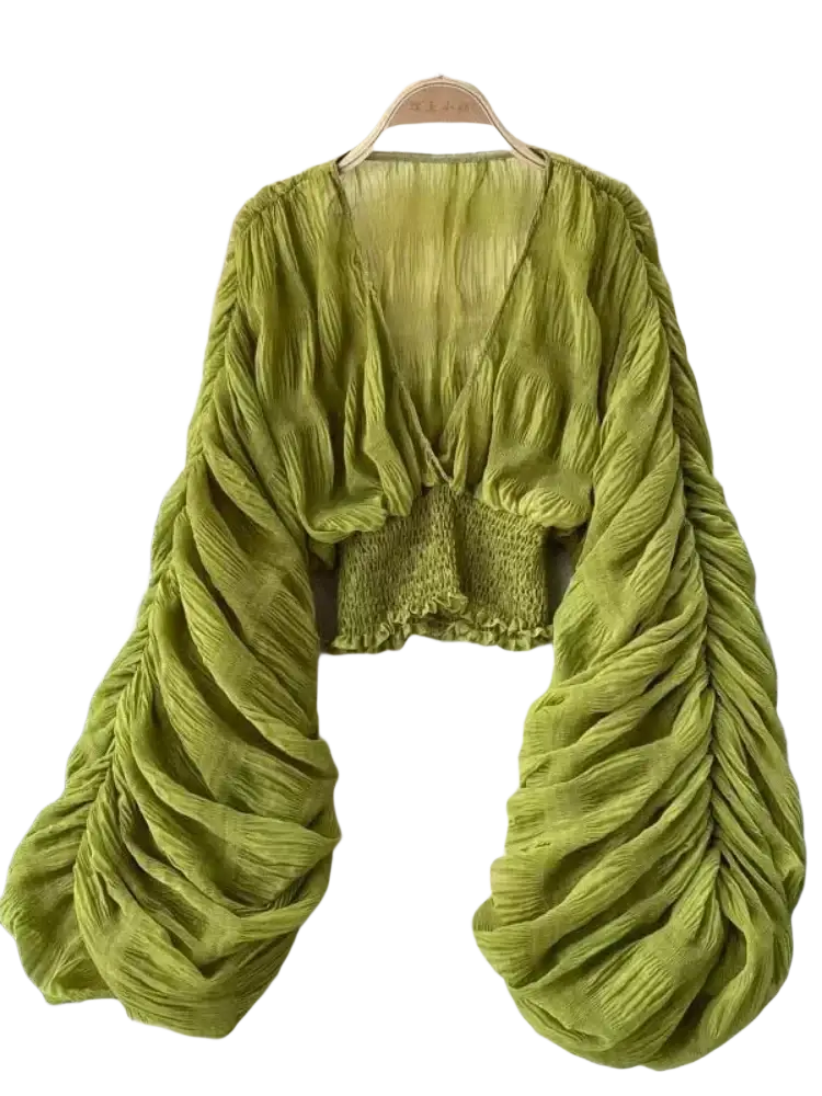 A vibrant olive green Korean v-neck lantern sleeve chiffon blouse with ruched long sleeves and a smocked waistband
