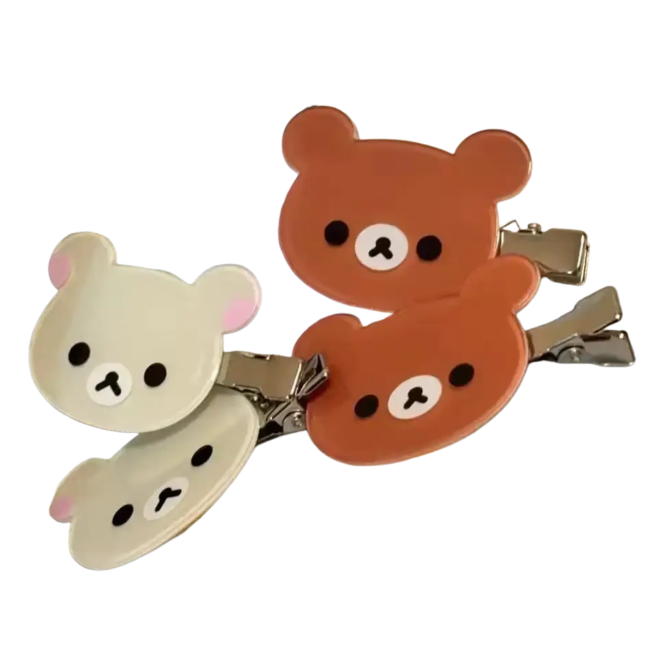 Rilakkuma korilakkuma hair clips featuring cream and brown glossy plastic bear faces with metallic silver clasps hair clips anime