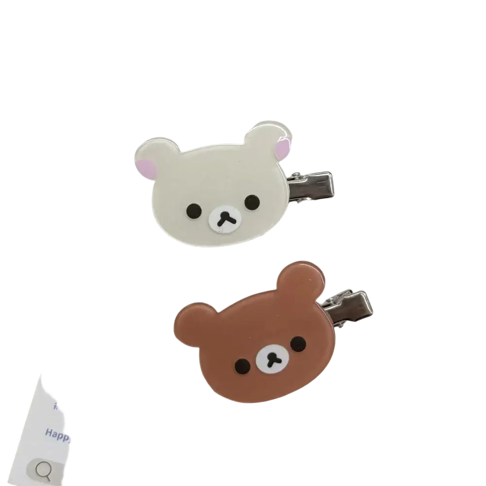 Cute white and brown korilakkuma hair clips with glossy plastic heads and metallic clamps for hair clips anime use