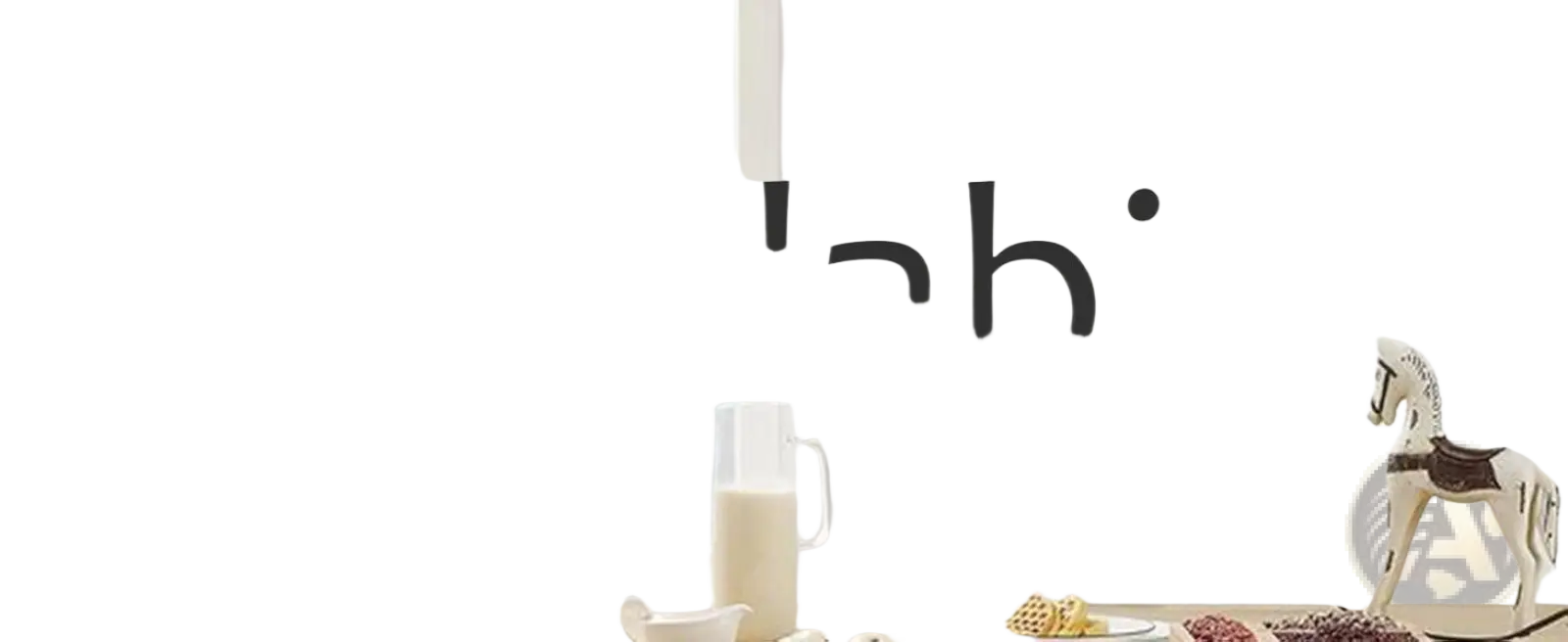 White ceramic horse figurine with brown saddle and decorative details displayed on l-shaped under sink organizer white metal