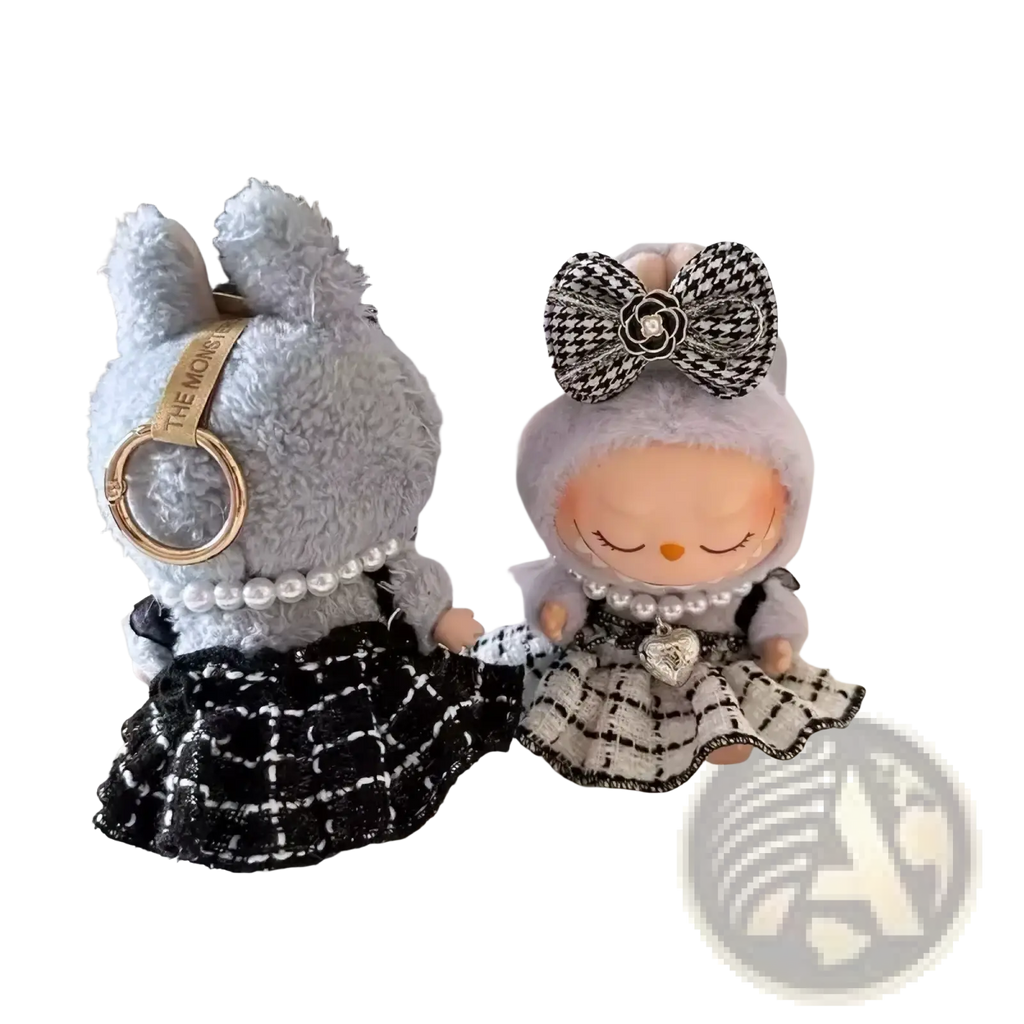 Gray plush bunny keychain wearing labubu black and white plaid doll outfit set with pearl necklace and gold ring